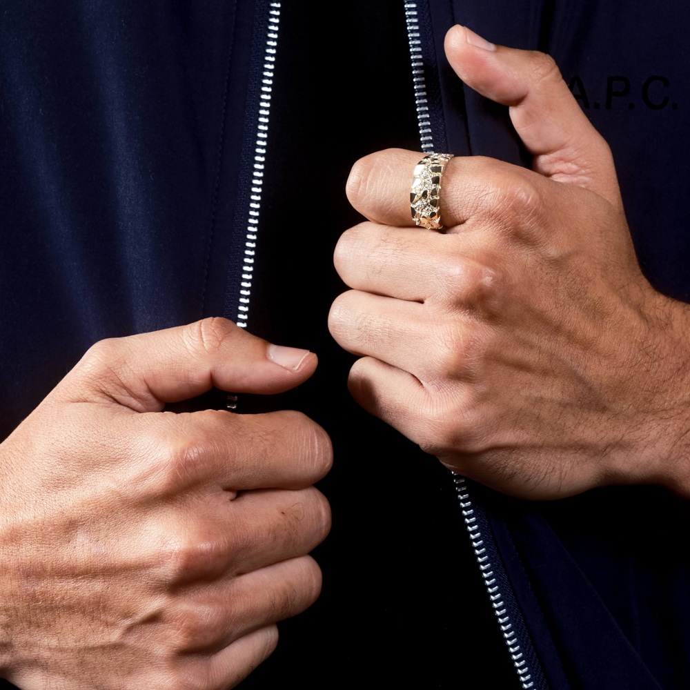 mens gold nugget ring on mans finger