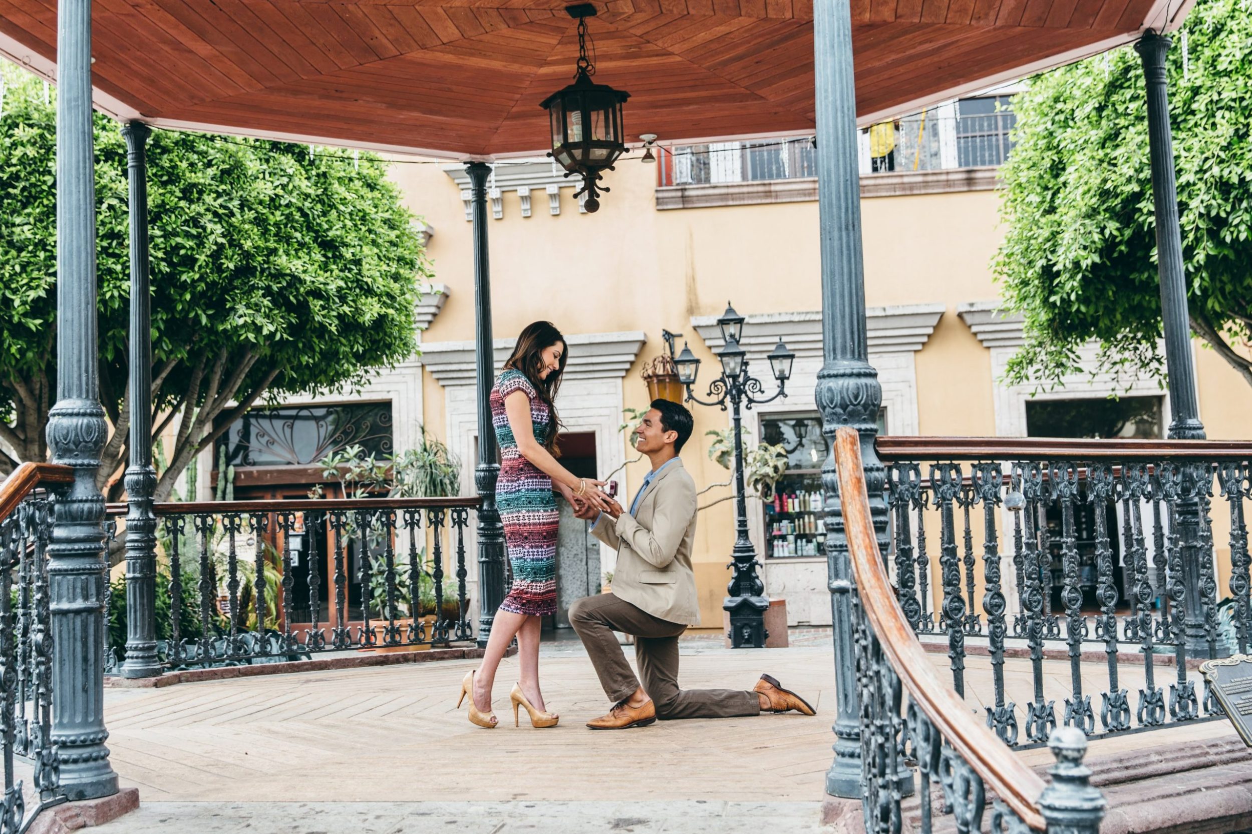 man proposing to woman with a perfect engagement ring