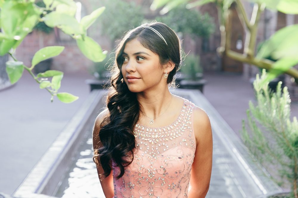 girl wearing quinceañera jewelry