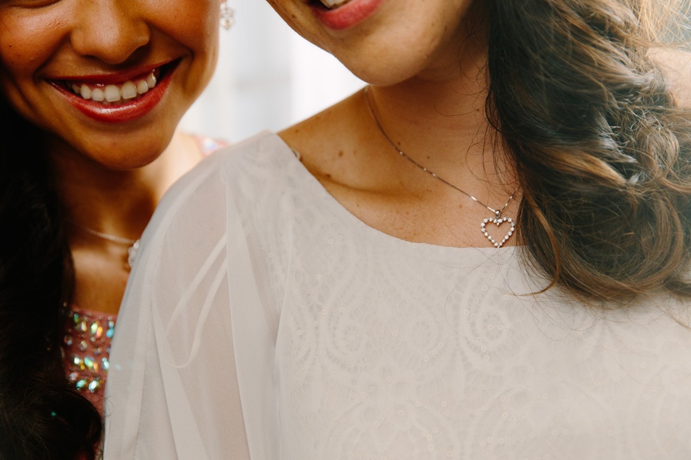 mom and daughter with heirloom heart necklace